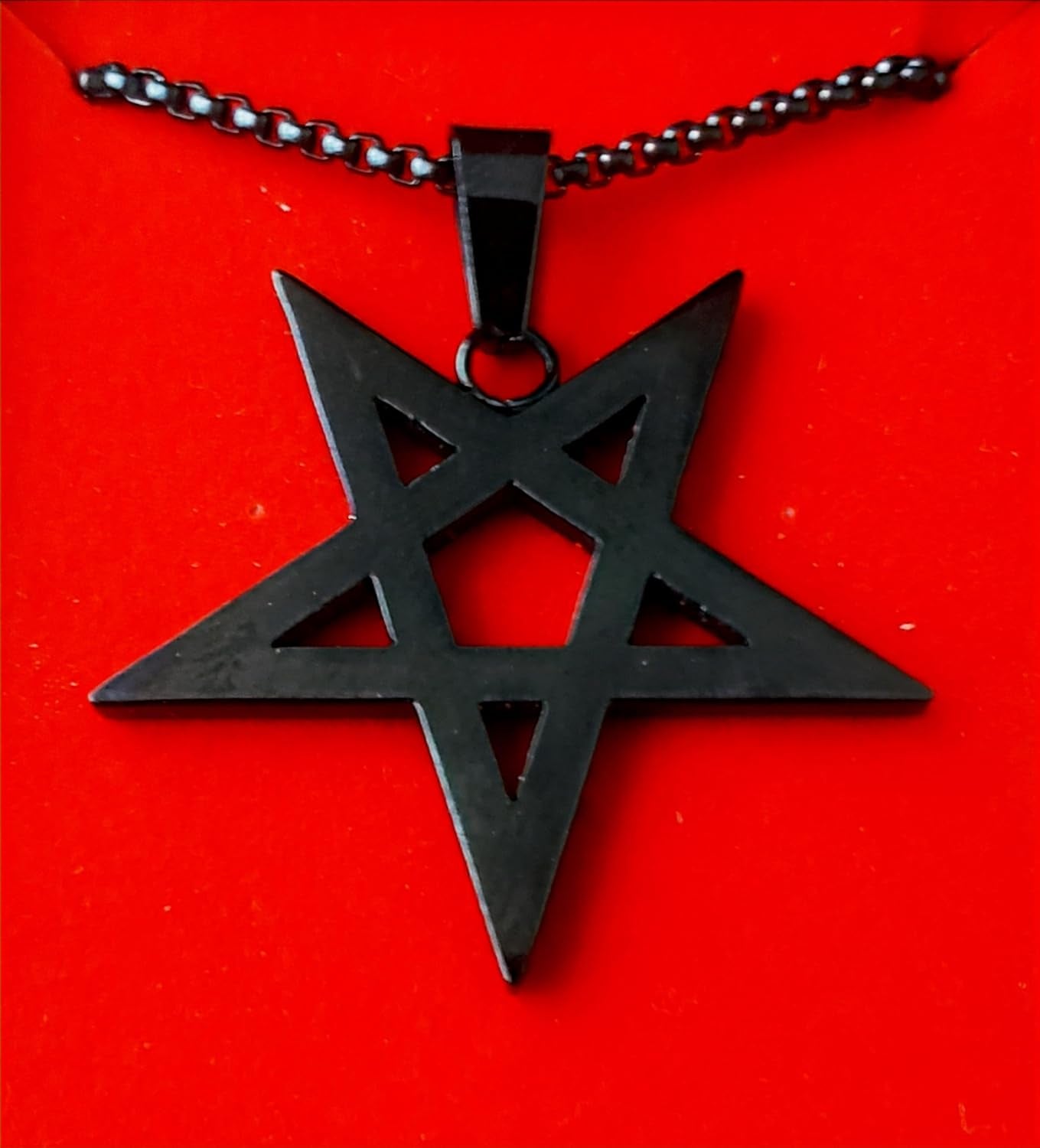 Gothic inverted pentagram necklace with occult design, black chain and silver pendant, perfect for witch and occult jewelry enthusiasts.