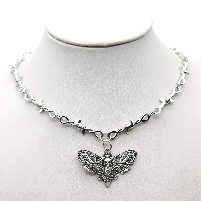 Gothic moth skull barbed wire choker necklace with small thorns, edgy punk hip hop jewelry for Y2K vampire style, black metal chain.