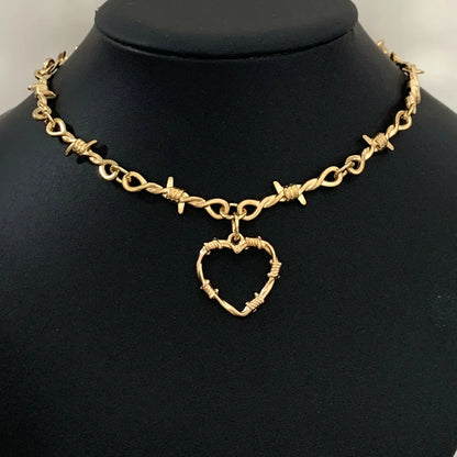 Gothic heart choker necklace with barbed wire design, hip-hop inspired jewelry for women, featuring edgy, bold style.
