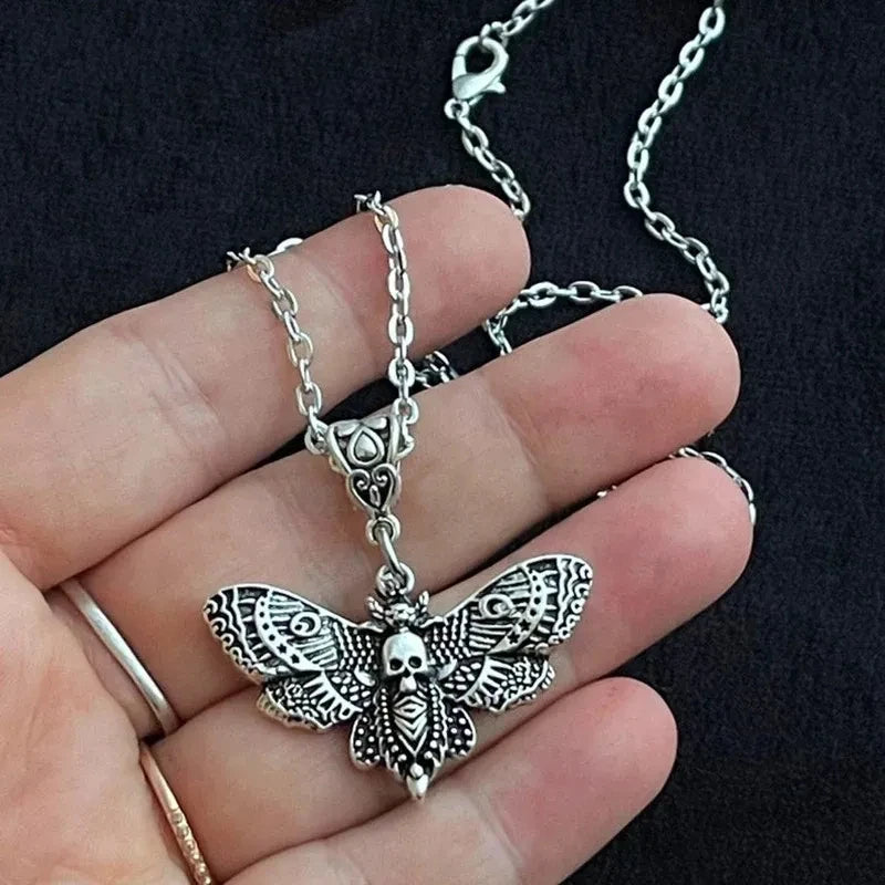 Gothic silver death moth necklace with 18-inch chain and sugar skull butterfly pendant, ideal for emo rock style jewelry.