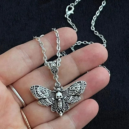 Gothic silver death moth necklace with 18-inch chain and sugar skull butterfly pendant, ideal for emo rock style jewelry.