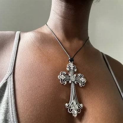 Rhinestone cross choker necklace with spiral design, goth punk style jewelry for women, featuring sparkling stones and bold fashion statement.