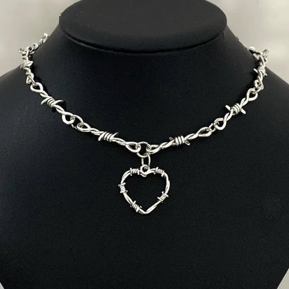 Gothic heart choker necklace with barbed wire design, hip-hop inspired jewelry for women, edgy gothic fashion accessory