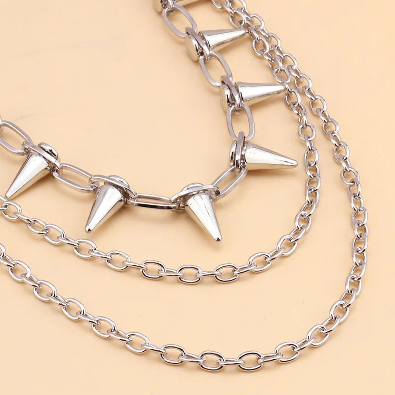 Layered punk spike and chain keychains for men and women, featuring edgy biker and goth style accessories.