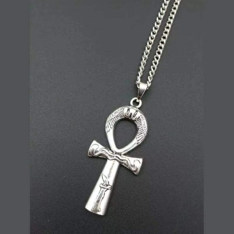 Y2K aesthetic razor blade pendant necklace featuring edgy vintage punk goth style jewelry for men and women.