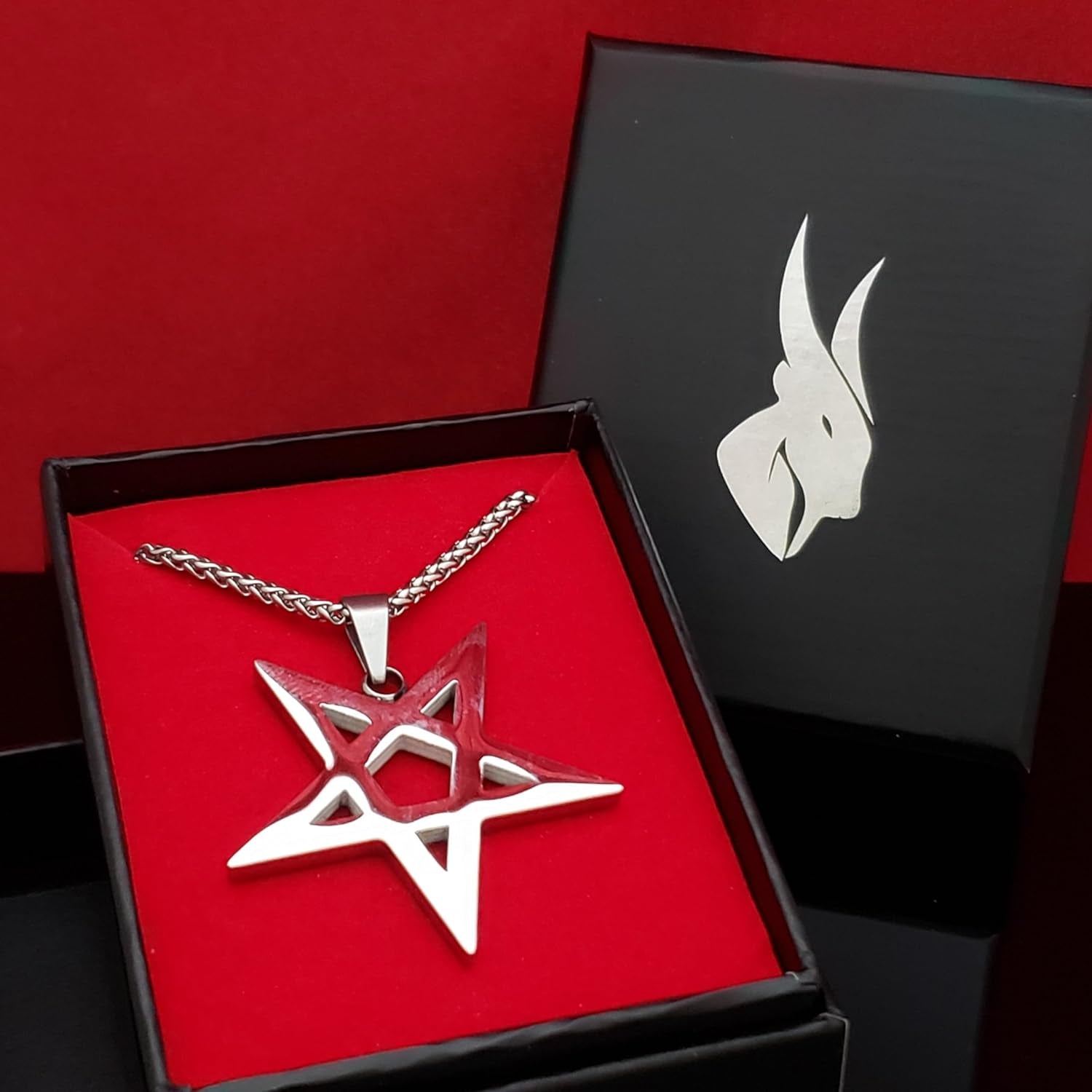 Black inverted pentagram necklace from XerxesJewelry, gothic occult jewelry perfect for witchcraft enthusiasts, featuring intricate design details.