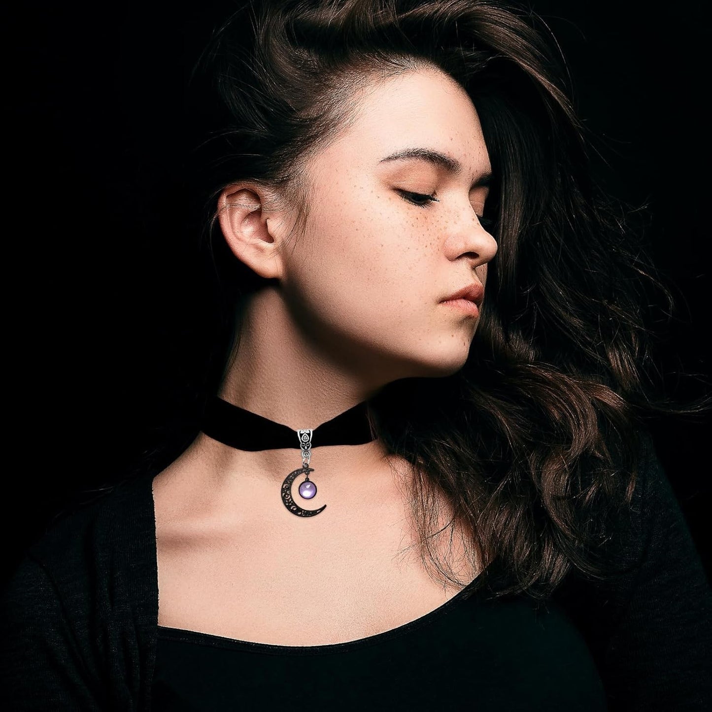 Gothic black velvet moon crystal choker necklace for women, featuring a moon-shaped pendant with sparkling crystals.