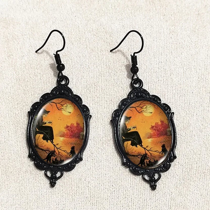 Mystical Gothic Witch cameo dangle earrings featuring vintage crystal glass and Victorian punk style jewelry design.