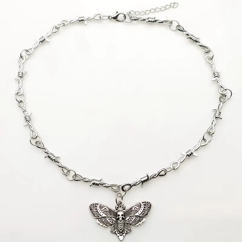 Gothic moth skull barbed wire choker necklace with small thorns, edgy punk jewelry for Y2K vampire style, black metal chain.