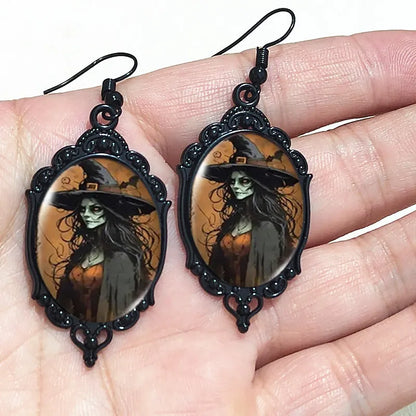 Mystical Gothic witch cameo dangle earrings with vintage crystal glass, featuring Victorian punk style jewelry design.
