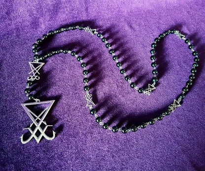 Luciferian sigil rosary necklace with gothic occult design, featuring dark metal beads and symbolic pendant for left hand path jewelry.