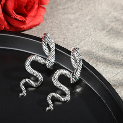 Vintage Gothic snake earrings by JSLOVFLO featuring gold and silver design, perfect for Halloween statement jewelry.