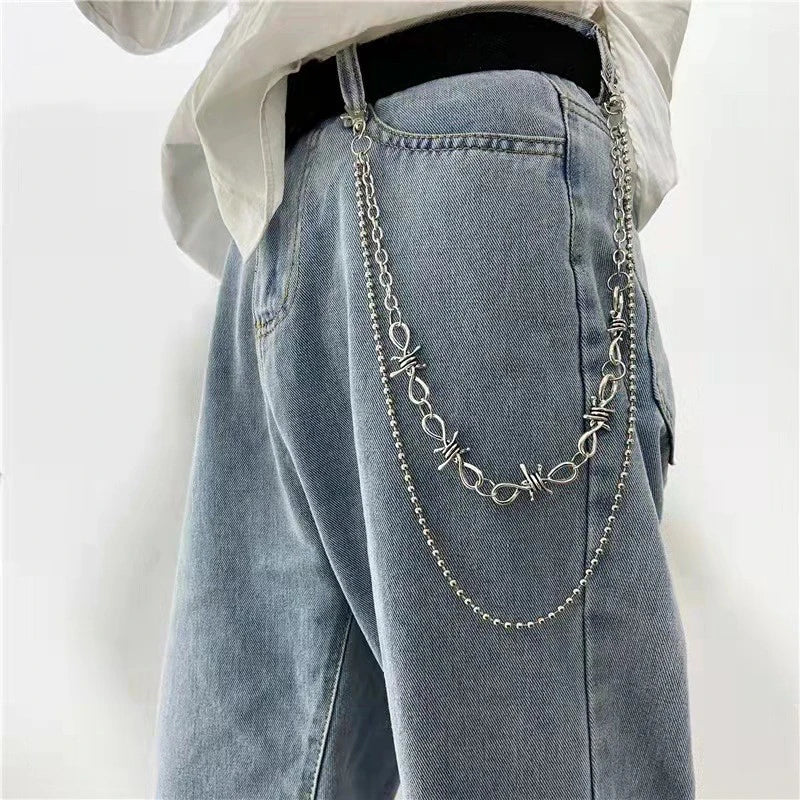 Layered punk spike and chain keychains for men and women, featuring edgy biker and goth style accessories.