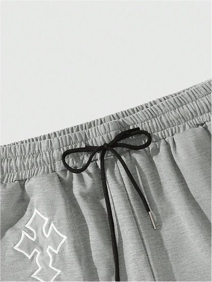Men's Gothic Cross graphic workout shorts by VIPWOLF featuring a drawstring waist, ideal for running and athletic activities.
