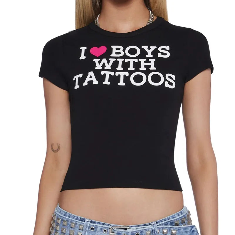 Black goth graphic crop top with 2000s Y2K Harajuku style, featuring bold aesthetic designs and trendy e-girl fashion elements.